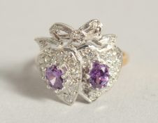 A SILVER AND 18 CT GOLD PLATED AMETHYST SWEETHEART RING.