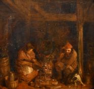 Dutch School (possibly 17th Century) An interior scene with a man and woman seated by a fire with