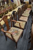 A set of seven Georgian style mahogany dining chairs, one with arms, six of which have hand made