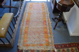 A small worn Persian rug, 193cm x 83cm.