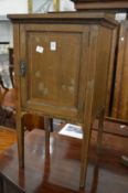An Edwardian mahogany pot cupboard.