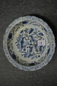 A Chinese blue and white scallop edged dish.