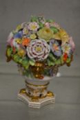A Stevens and Hancock Derby flower encrusted urn.
