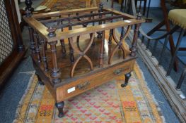 A Victorian inlaid rosewood three division Canterbury with a drawer to the base.