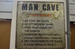 A 'Man Cave' sign.
