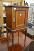 An Edwardian mahogany pot cupboard.