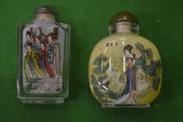 Two modern Chinese reverse painted glass snuff bottles.