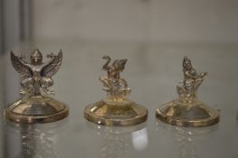 A set of fifteen silver place name holders modelled as Eastern figures and animals.