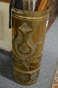 A heavy brass stick stand with incised decoration.