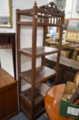 A pair of Eastern hardwood three tier shelving units with storage below.