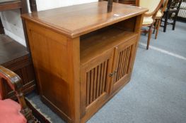 A teak storage cupboard.