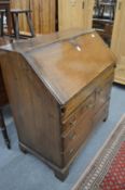 A George III oak bureau.