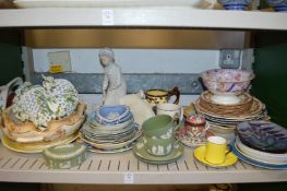 A shelf of decorative china.