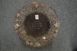 A good silver presentation pedestal dish with pierced and engraved grape and vine border.