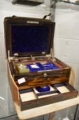A good Victorian coromandel dressing case with fitted fitted interior complete with leather outer