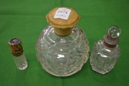 Three perfume bottles.