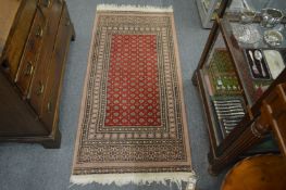 A small modern Persian design rug, 144cm x 66cm.