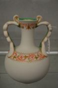 A classical revival painted and gilt decorated parian china vase.