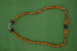 An amber style necklace.
