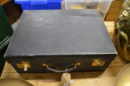 A leather travelling case with silk lined interior.