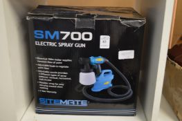 An electric spray gun, boxed.