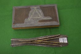 A Commemorative paperweight and a printing block.