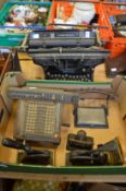 An early Underwood typewriter and other office equipment.