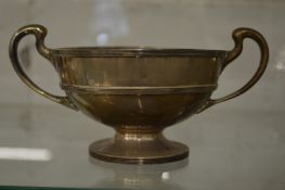 A silver twin handled pedestal bowl.