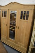 A French pine three door wardrobe.