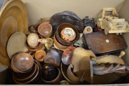 A box of turned wooden and other items to include numerous bowls etc.