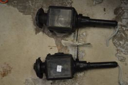 A pair of coaching lamps converted to electricity.