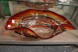 A large colourful moulded glass dish.