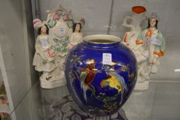 A Staffordshire flat back figure group, a similar spill vase and a Carlton ware vase (af).