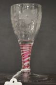 A good small Jacobean wine glass, the bowl engraved with a rose and butterfly with pink and white