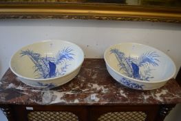 A pair of blue and white decorated bowls.
