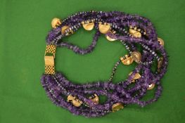 A large decorative amethyst and gilt metal necklace.