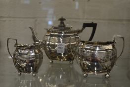 A silver three piece tea service.