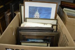 A box of assorted paintings and prints.