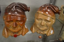 A pair of large salt glazed wine dispensers modelled as busts of men with bow ties.