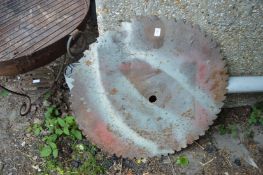 A large circular saw blade.