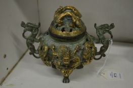 An ornate Chinese bronze censer and cover.