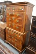 An 18th century walnut chest on chest with moulded cornice, three small drawers above three