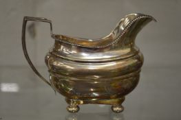 A silver cream jug.