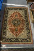 A Persian design rug with floral decoration, 138cm x 90cm.