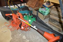An electric lawn mower, leaf blower and vacuum and a Flymo strimmer.
