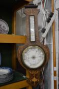 A good Victorian inlaid rosewood barometer/thermometer.