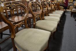 A good set of six Victorian walnut balloon back dining chairs on cabriole legs.