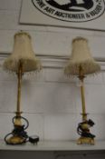 A pair of ornate table lamps.