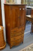 A small mahogany bow front cupboard on chest.