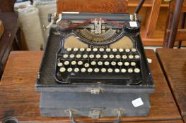 A cased Corona typewriter.